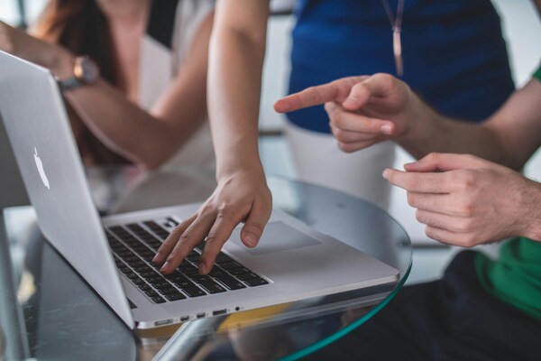 People working on a laptop together