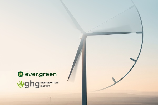 The colors of a sunset paint the background while a wind turbine with its blades appearing to be the hands of a clock. On the bottom left corner sits the logos for Ever.green and GHGMI